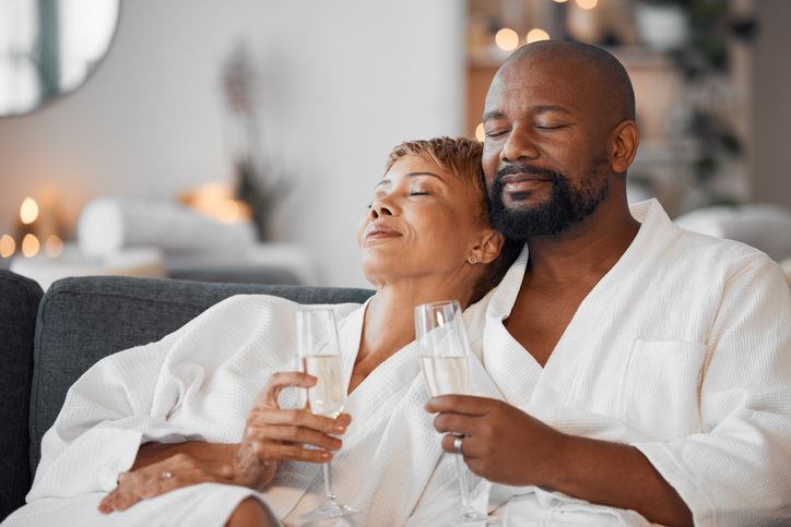 Man and woman relaxing with champagne at a spa. 