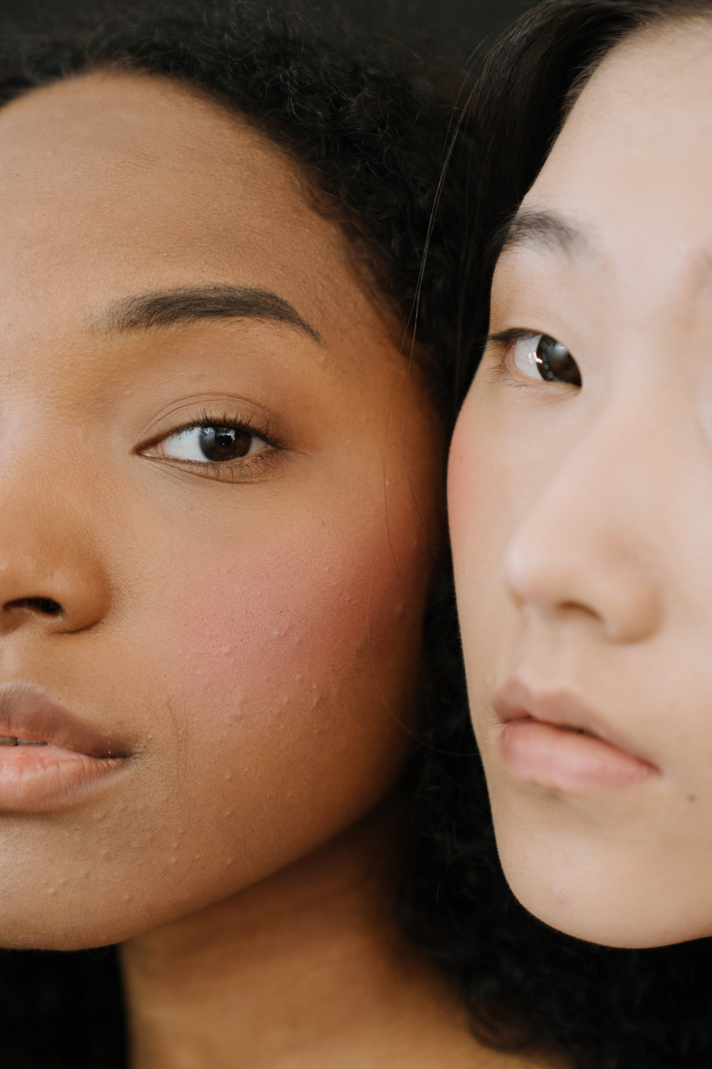two women with clear skin and youthful glow