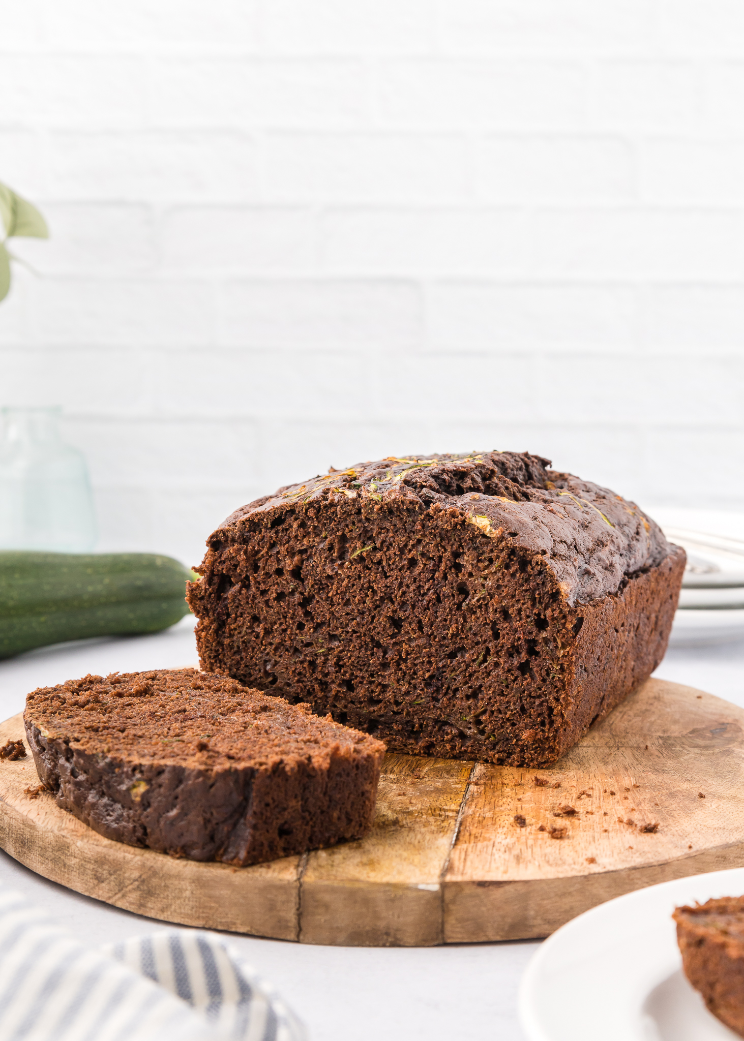 sliced chocolate zucchini loaf on a wooden cutting board