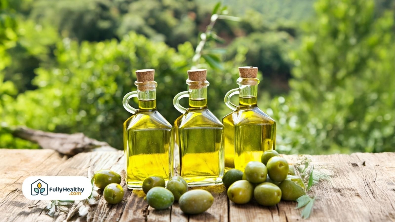 Three bottles of olive oil with green olives in natural outdoor setting