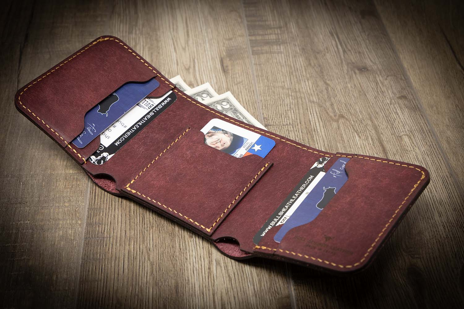 A trifold ID wallet with traditional style and features badge
