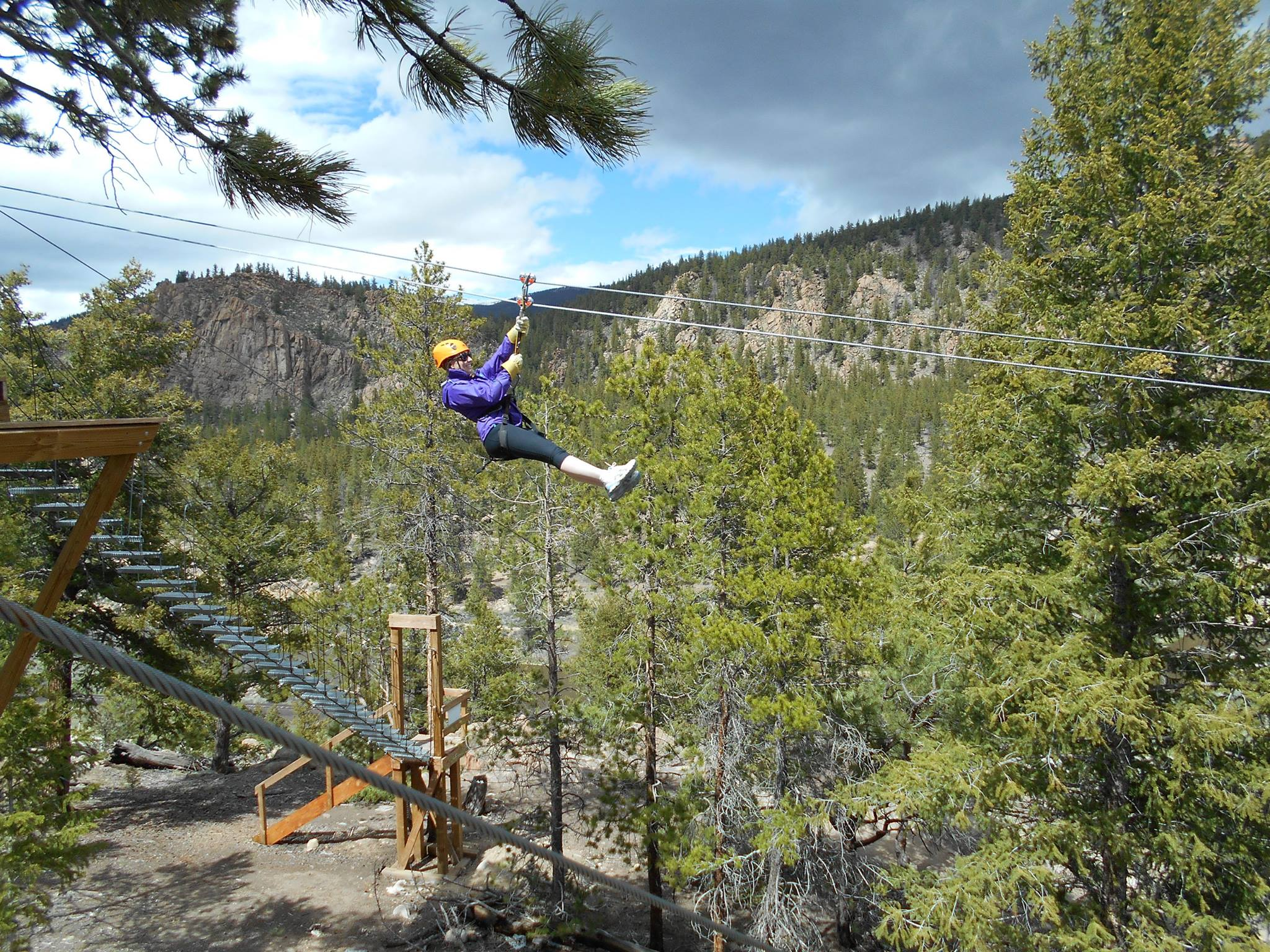 A woman ziplining at AVA Cliffside Zipline 