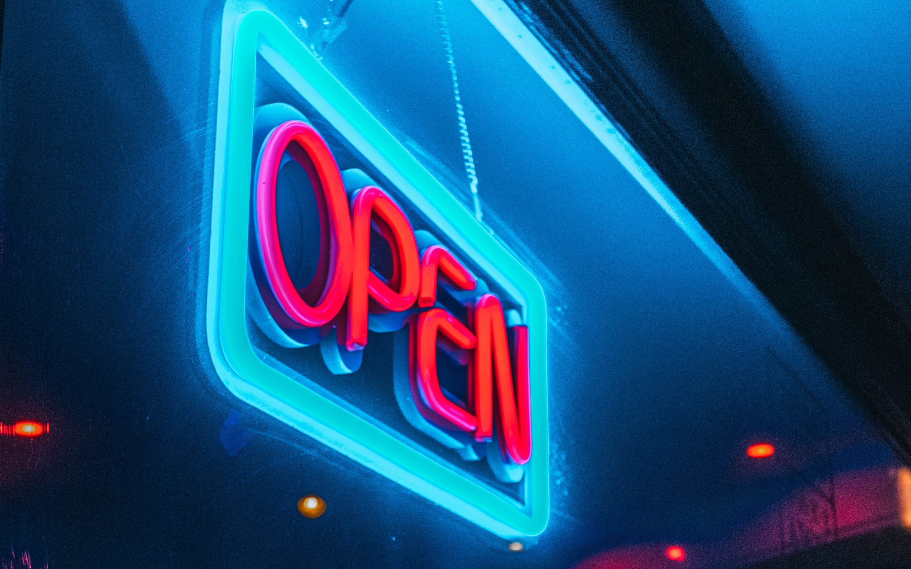Neon Open Sign Hanging in a Bar Window