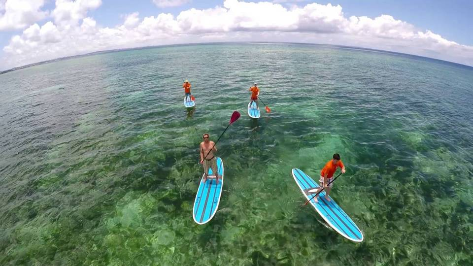 Surfers at Okinawa, photo via Living Nomads