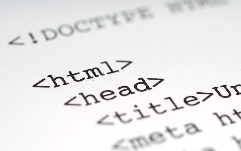 Close up of HTML. Schema markup can help a business website stand out. 