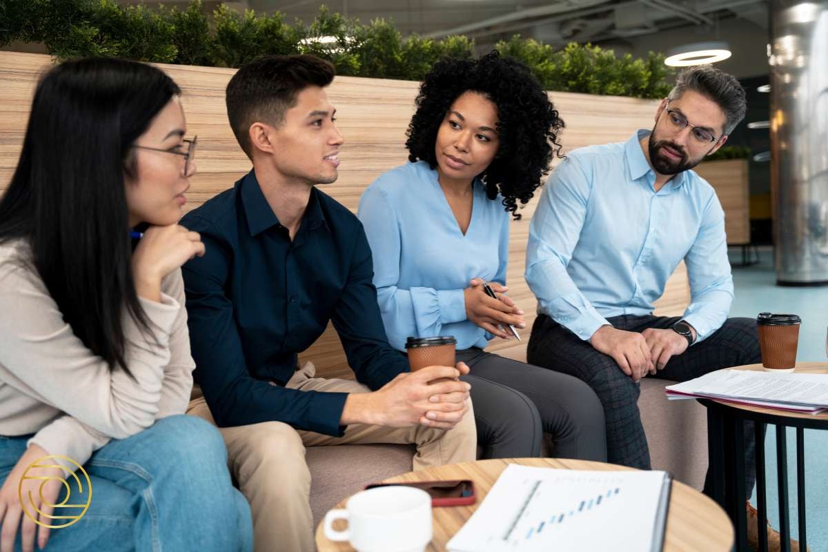 Group of professionals in a meeting discussing strategies for impactful leadership – Increase My Impact Through Others and Strategically