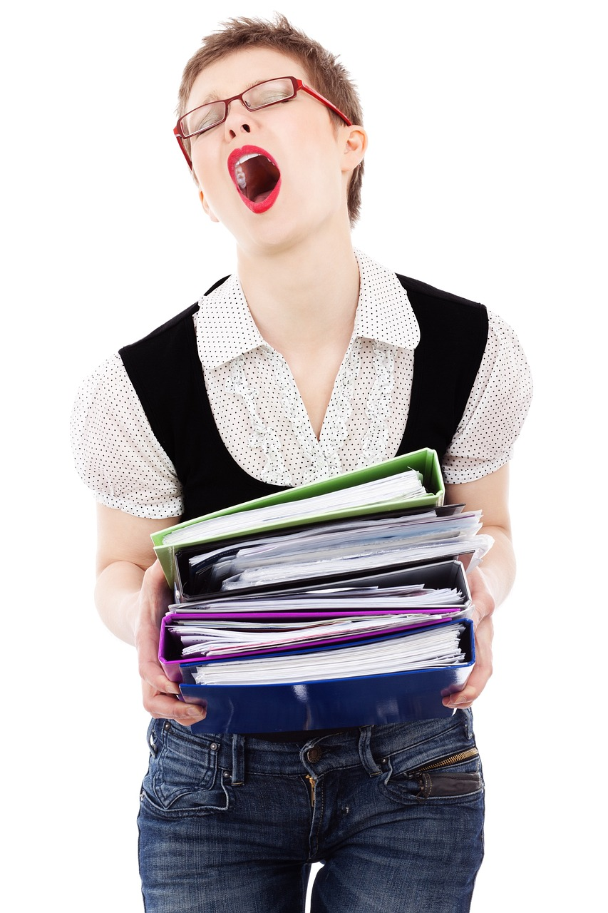 An image of a woman with mouth open, shouting at the amount of work she has to do. 