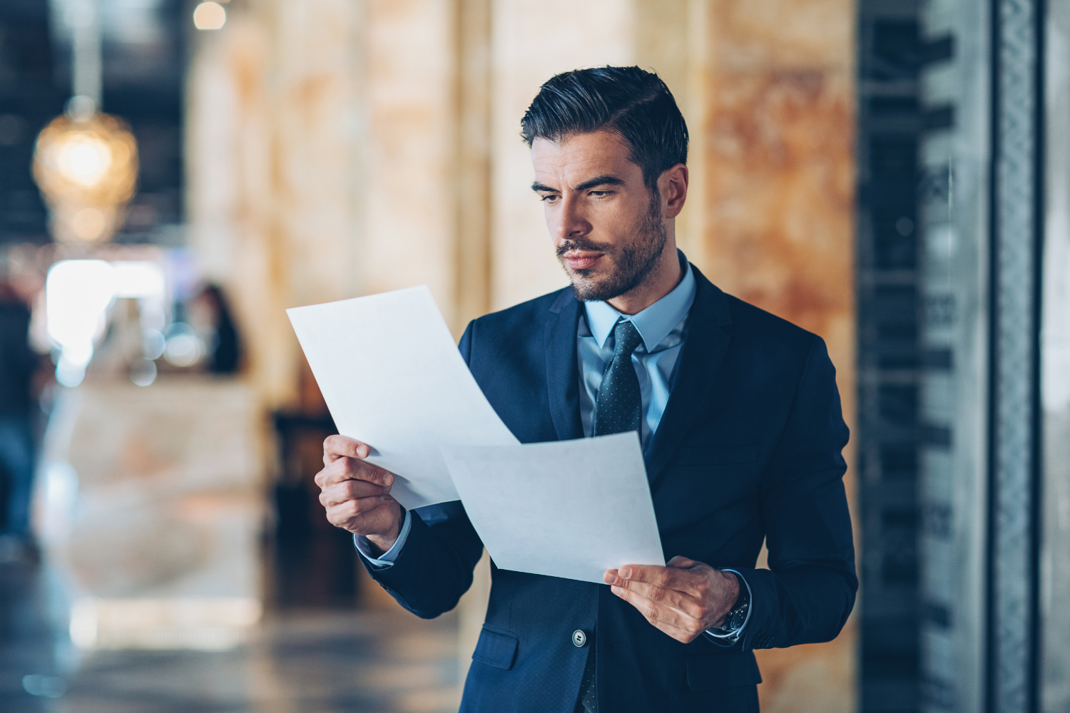 Business professional looking at documents.