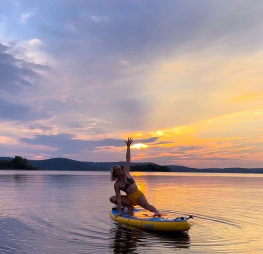 sup yoga workout at sunset