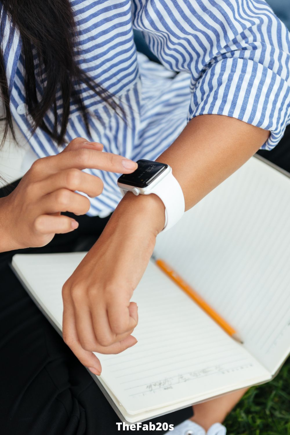 Scorpio woman checking her watch - Featured In Article about Gemini and Scorpio compatibility 