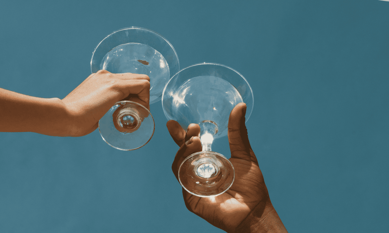 two people doing a cheers together.