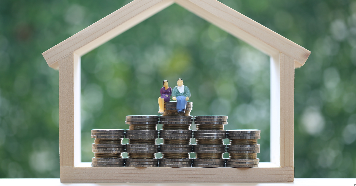 dual key homes - image of dummy house with coins and a dummy toy of couples