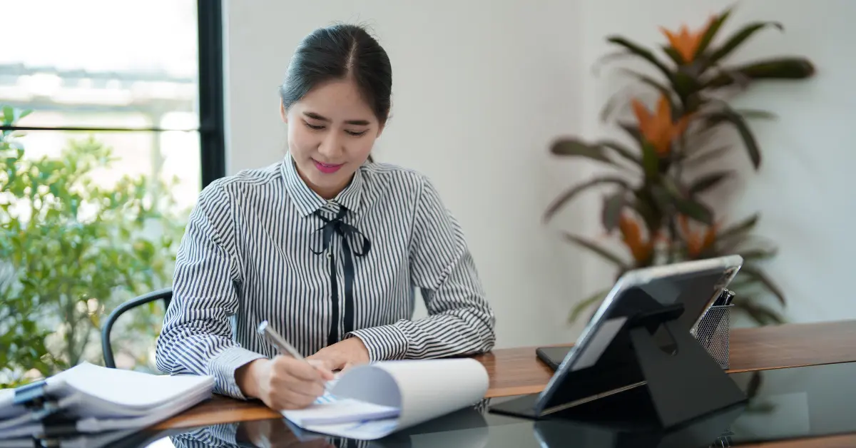 A successful content creator reviewing her official IRS tax transcript in her home office.