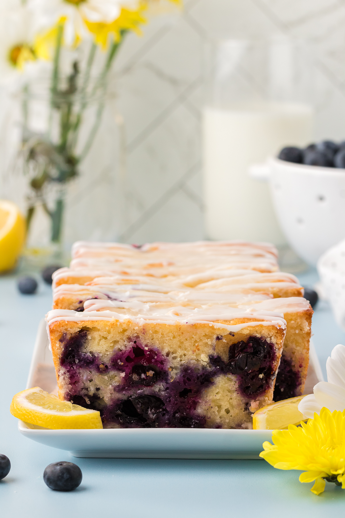 sliced blueberry lemon loaf on a plate