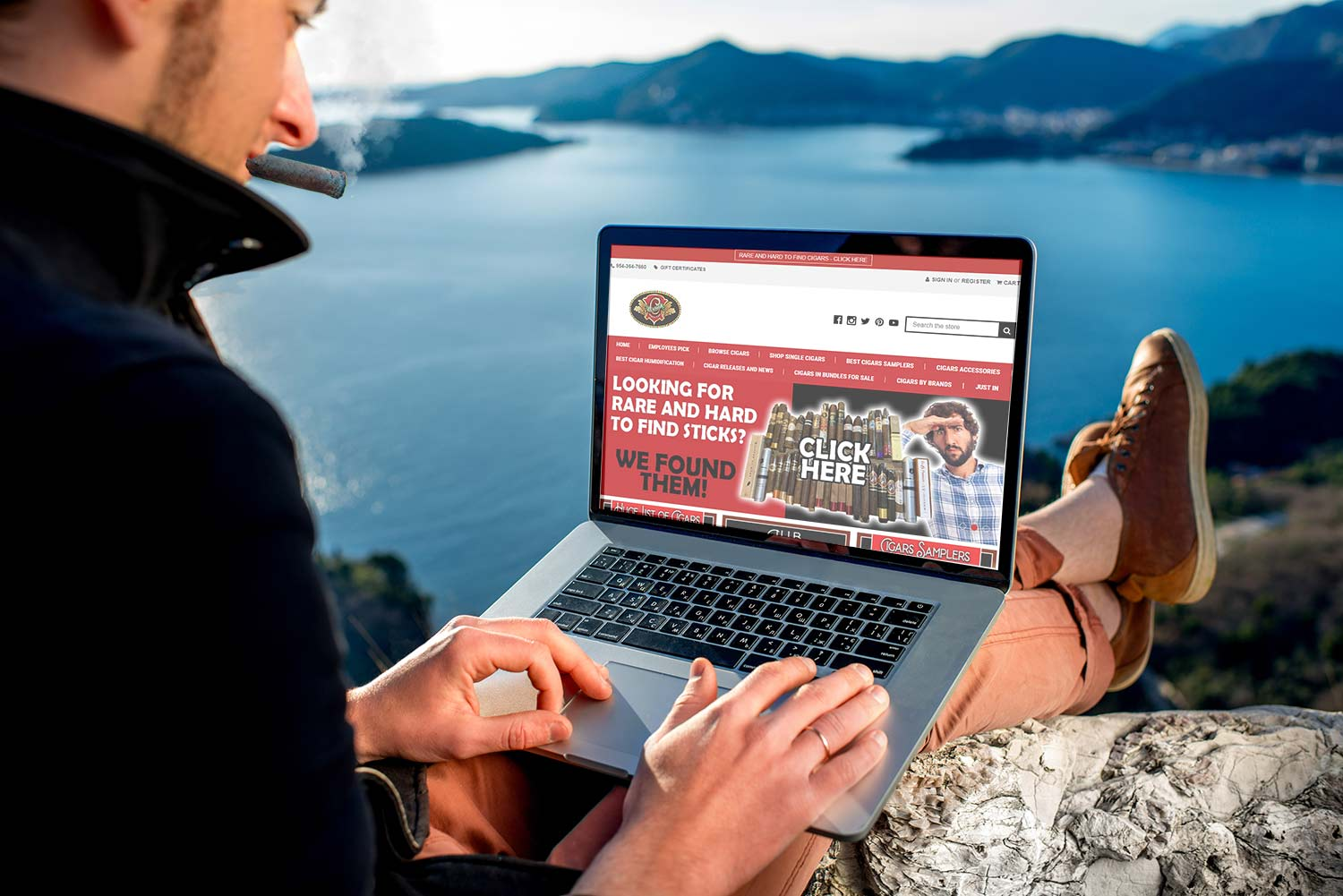 A man holding a cigar and looking at a laptop with a Cuenca Cigars website open