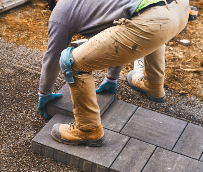 worker wearing knee pads at work - knee protect