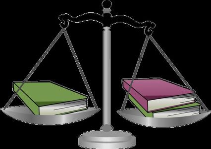 Scale of justice with law books balanced