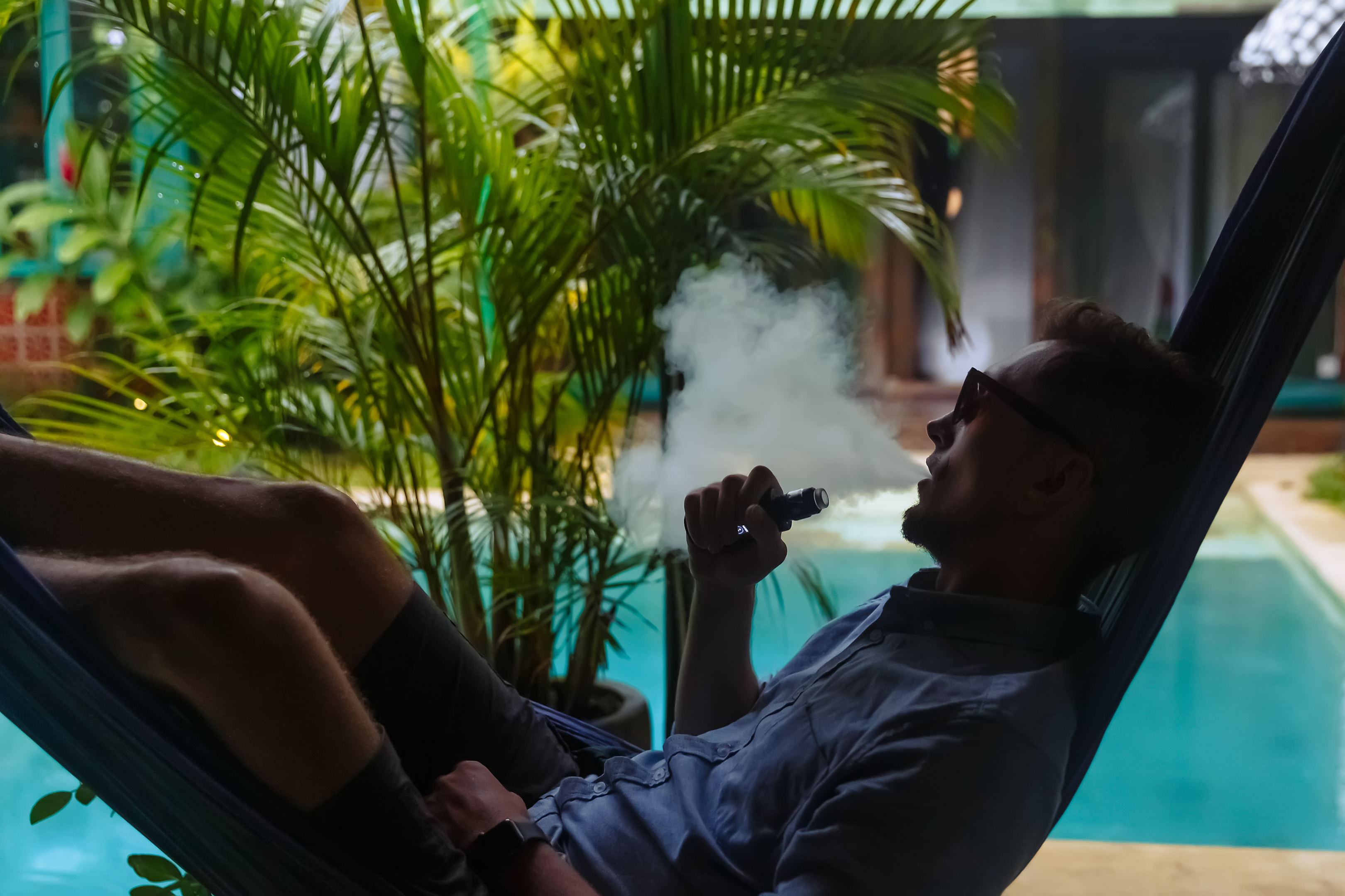 Guy hitting his CBD vape with high quality CBC and CBD oil or vape liquid. CBD oils in CBD pens should be high quality from pure CBD like Comfortably Numb with CBD CBN. 