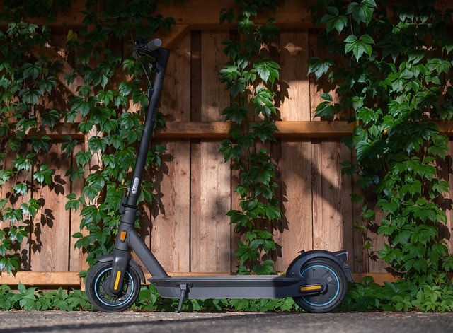 Electric scooter parked up outside.