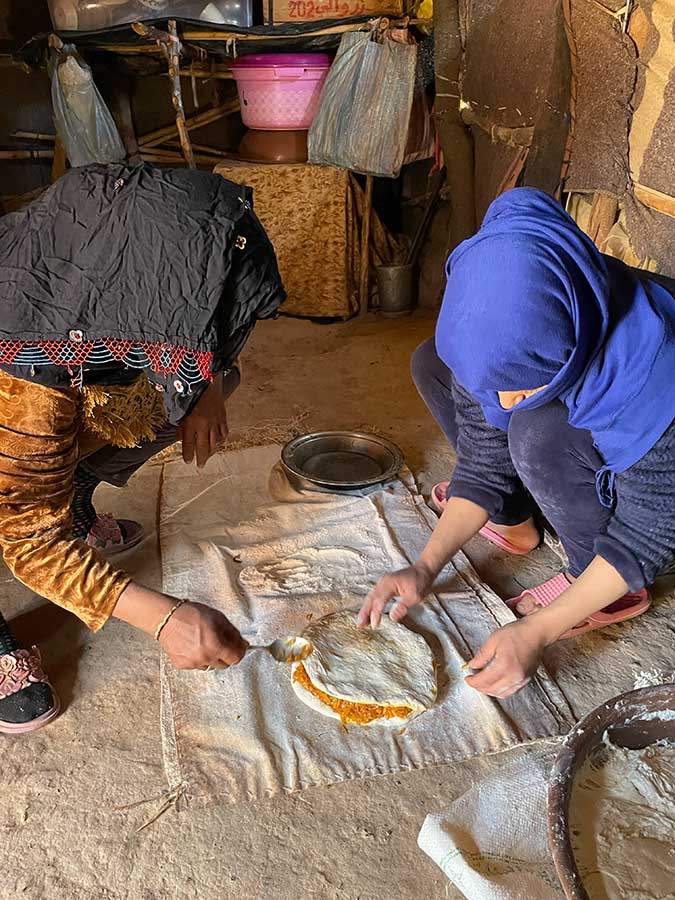 Medfouna, a unique pizza-stylebread pie from the Sahara Desert.