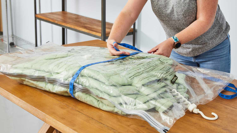 Resealable tamper-evident storage bag for apparel packaging