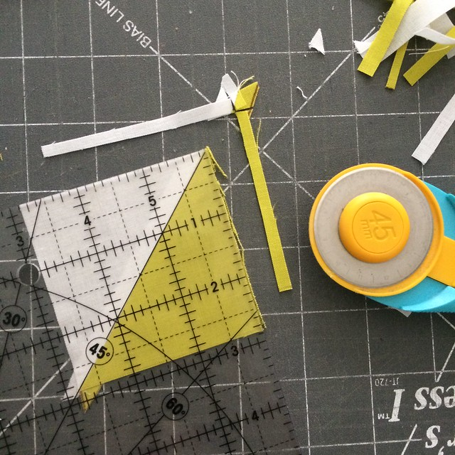 Trimming an HST block with a square ruler