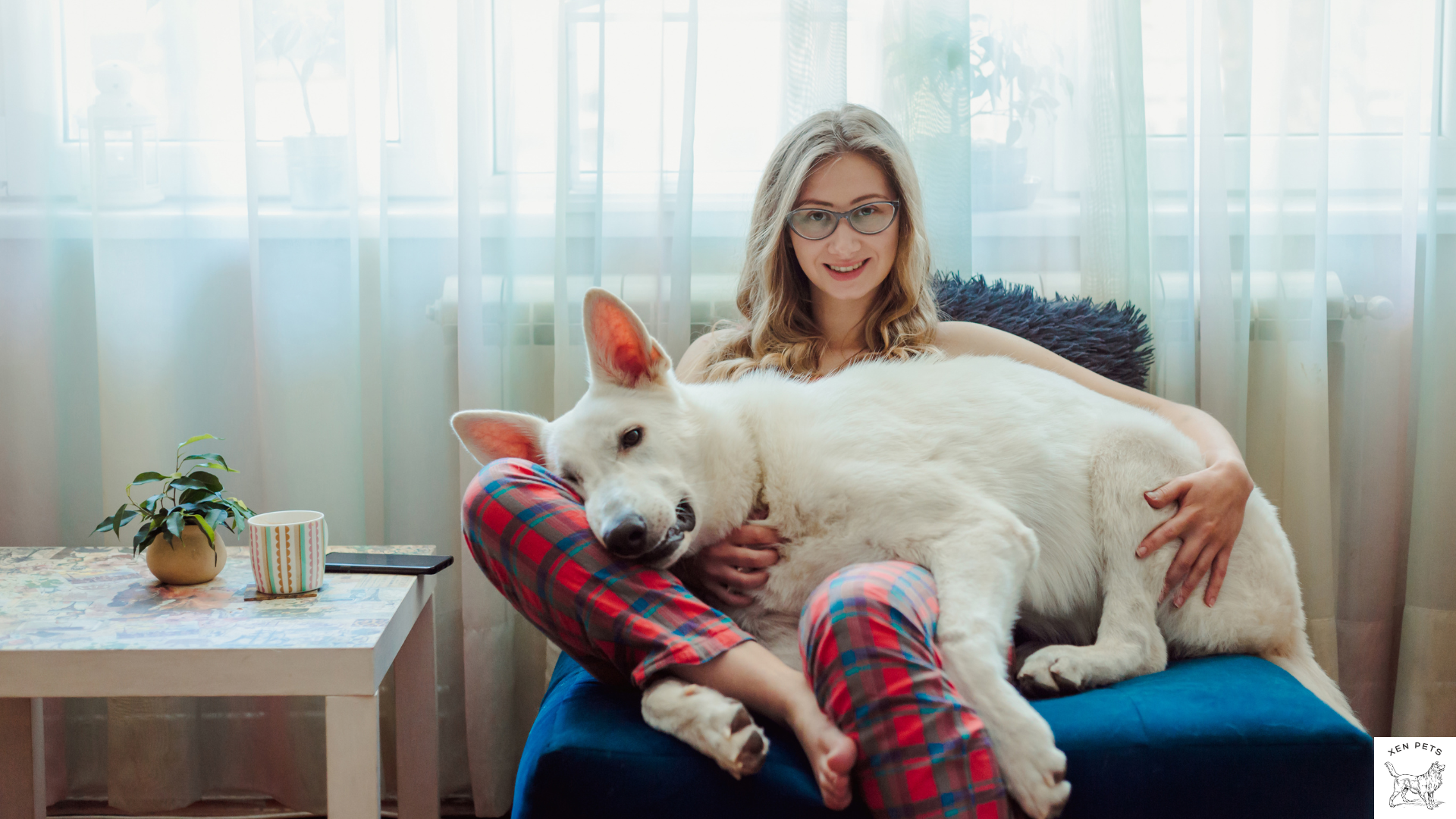 woman cuddling with white dog