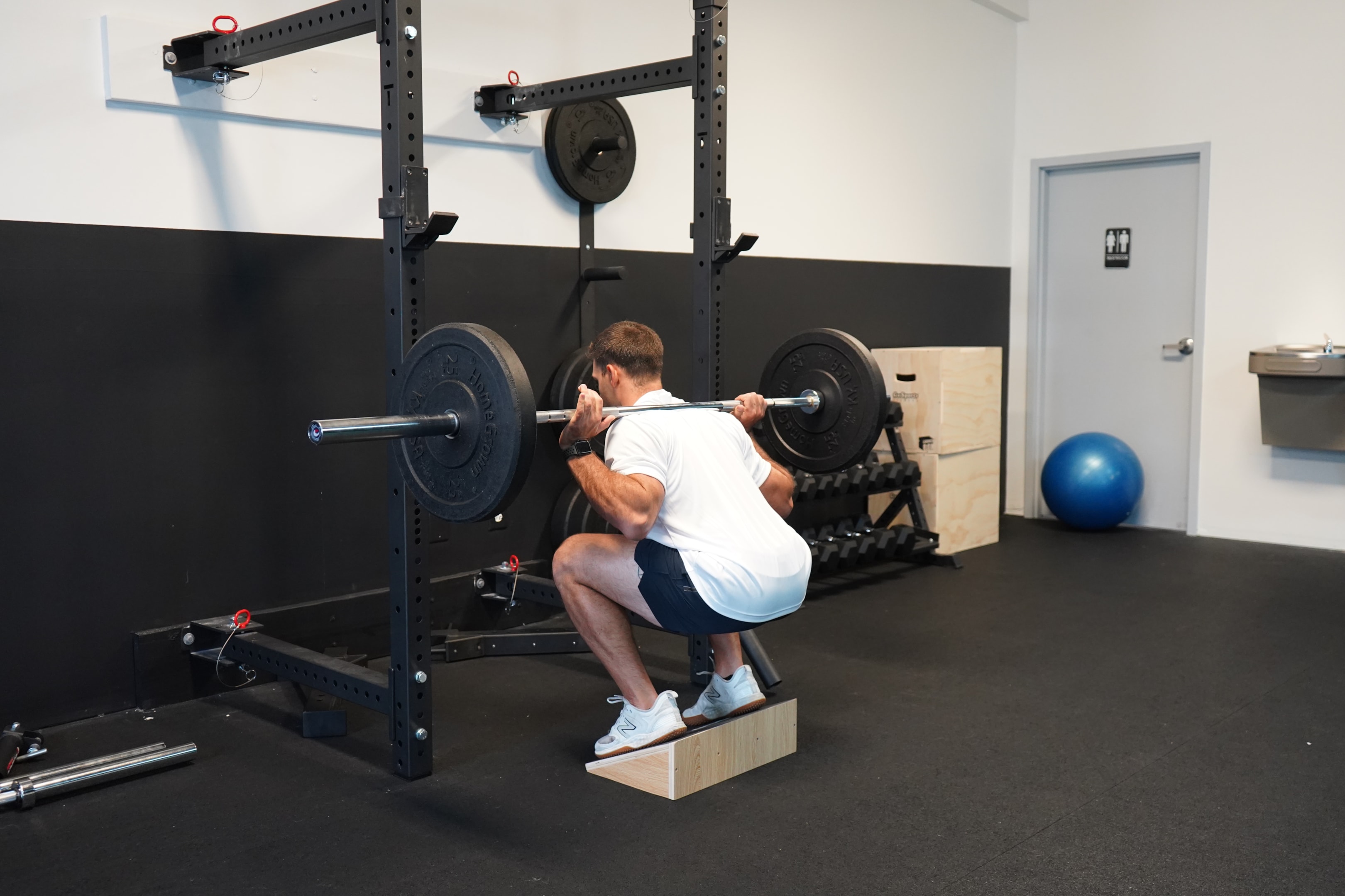 The body weight and barbell version of these slant board exercises have a similar starting position. The only difference is the load you put on your body.