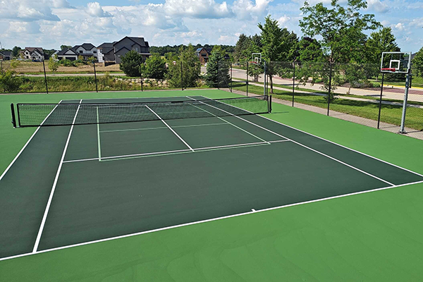Resurfaced court at Westbridge Park Waunakee, WI, rejuvenated with a comprehensive resurfacing process by Pto Track & Tennis