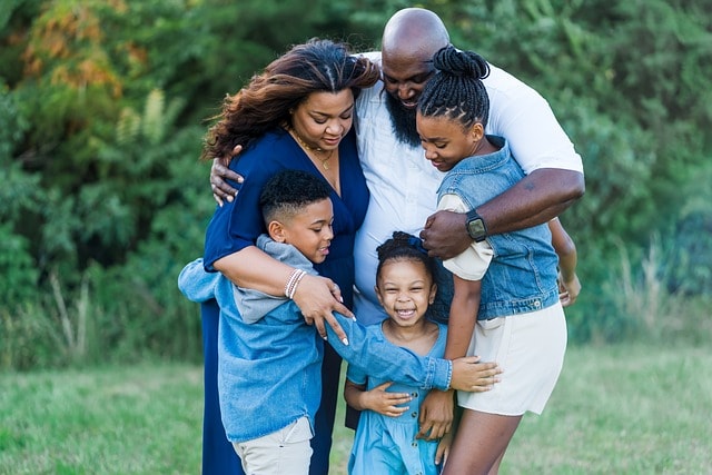 family, african-american, happy and runified after dad decided to seek treatment 