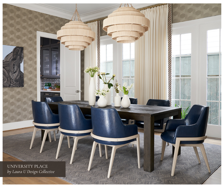 Inviting dining space with navy blue leather chairs, a rustic wood table, textured wallpaper, layered drapery, and twin woven pendants for a casual yet tailored modern aesthetic.
