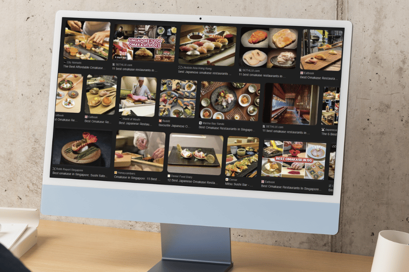 A desktop monitor displaying a grid of high-quality food images from various Singapore omakase spots, showcasing how visual content influences dining choices.