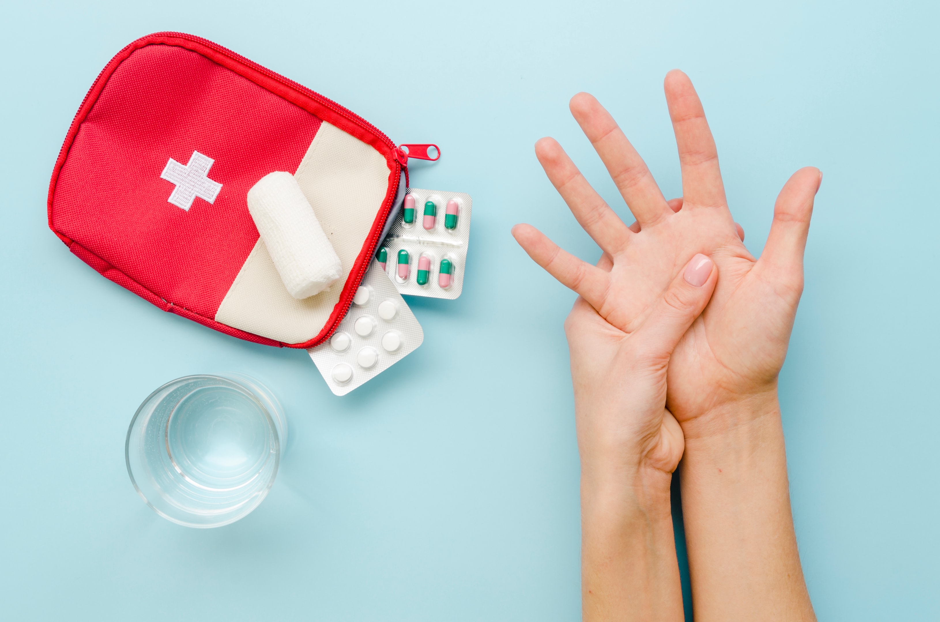 A person following first aid instructions using a well-prepared kit.