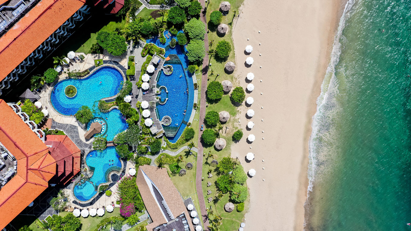 Grand Mirage Resort & Thalasso Bali pools and swim-up bar by the beach