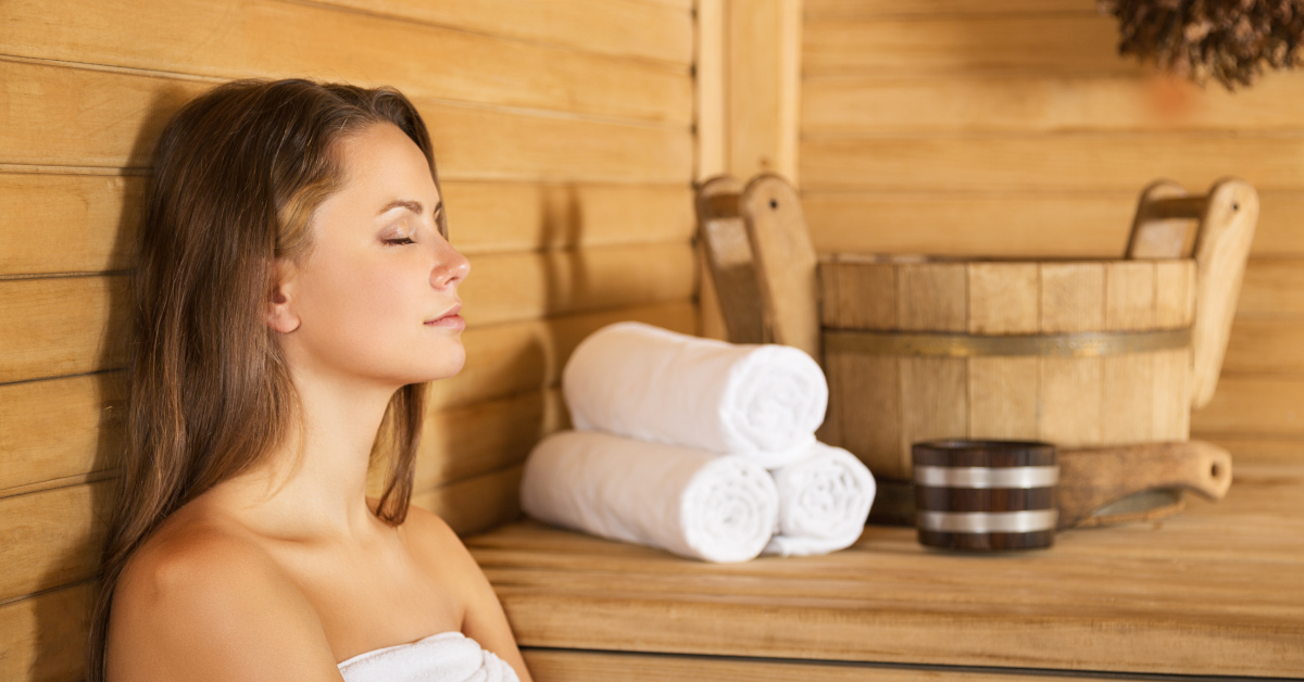 A woman enjoying peace and bliss inside her home sauna.