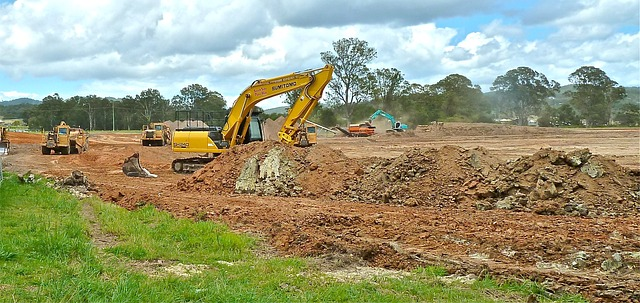An excavator clearing ground