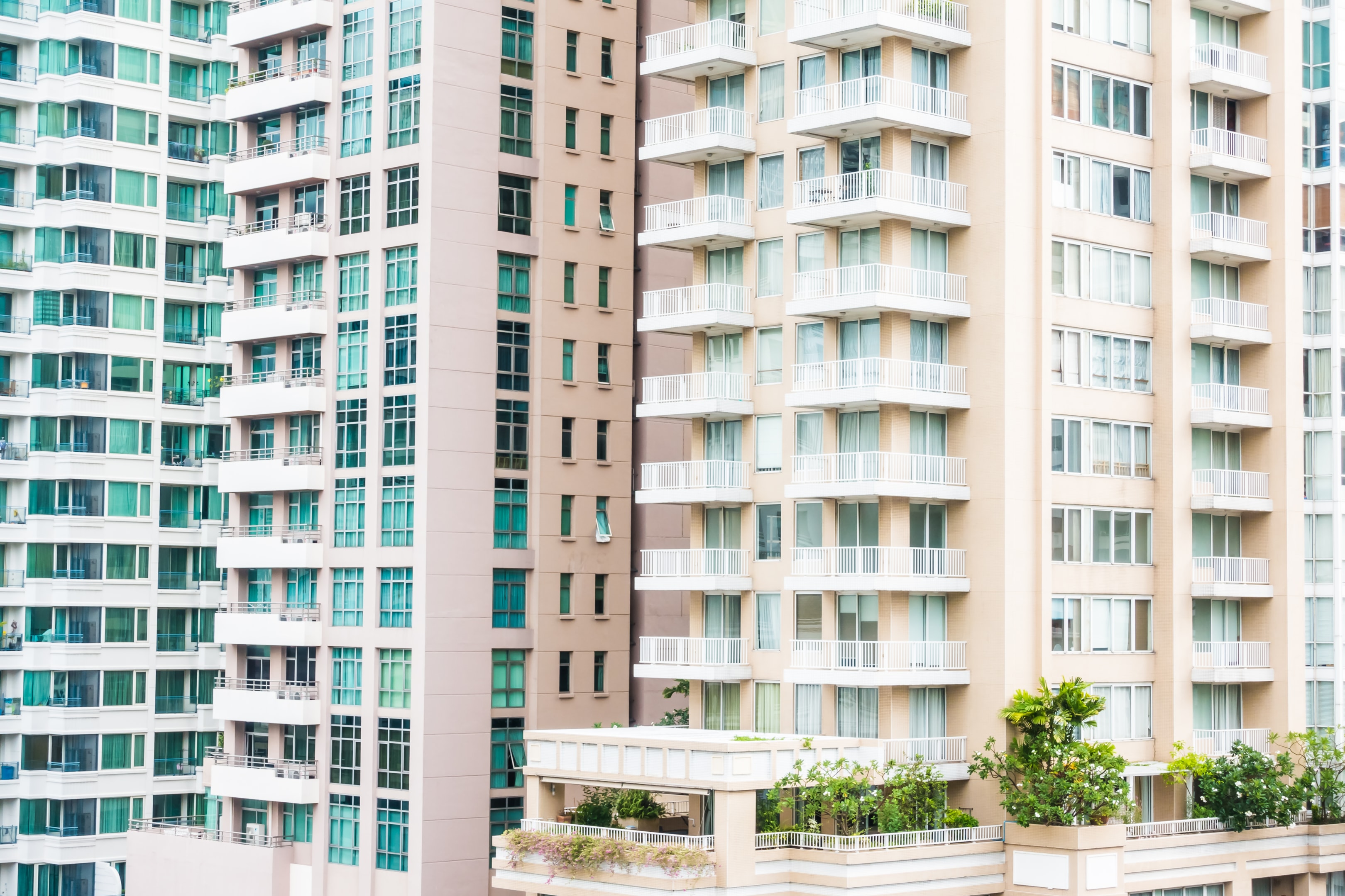 Residential buildings with balconies and vegetation