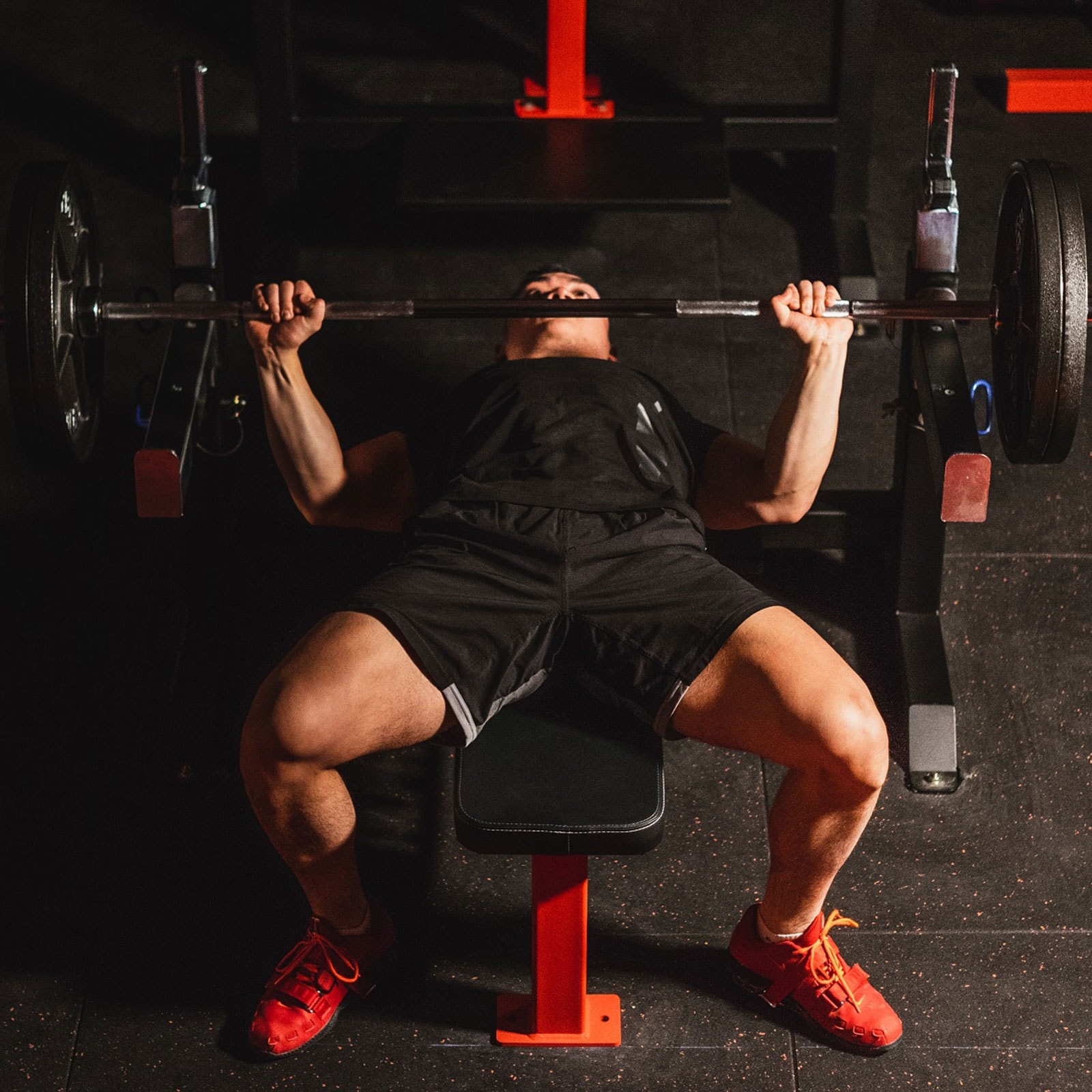 Man doing Bench press on a weight bench