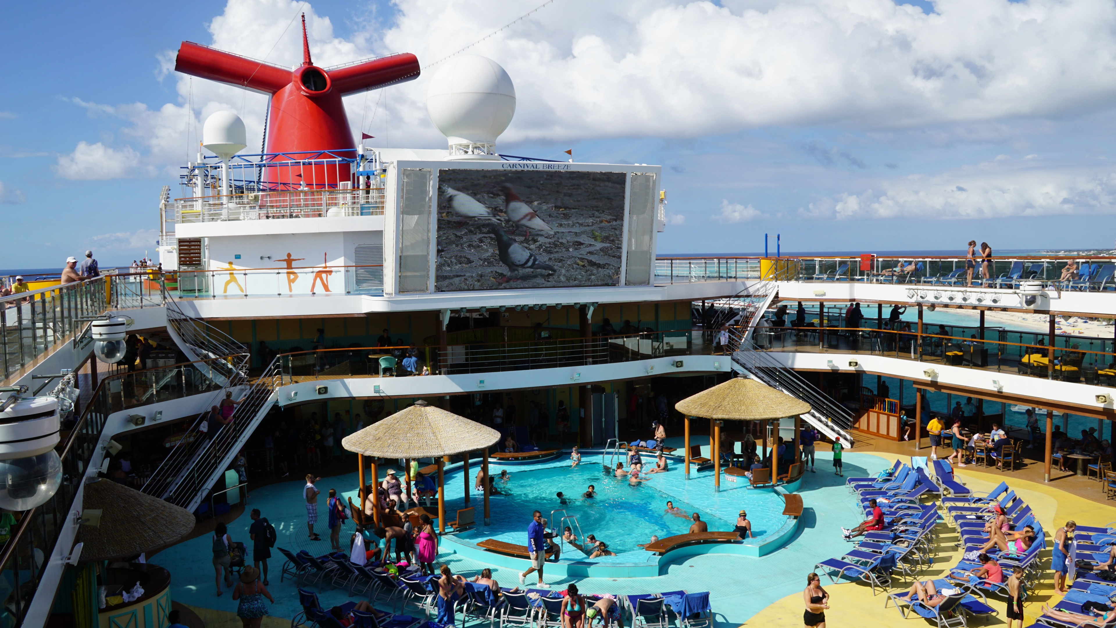 Lido Deck - Poolside on the Carnival Breeze docked in Miami, Florida, on Nov 21, 2015. The Breeze is a Dream-class cruise ship owned by Carnival Cruise which entered service in June 2012