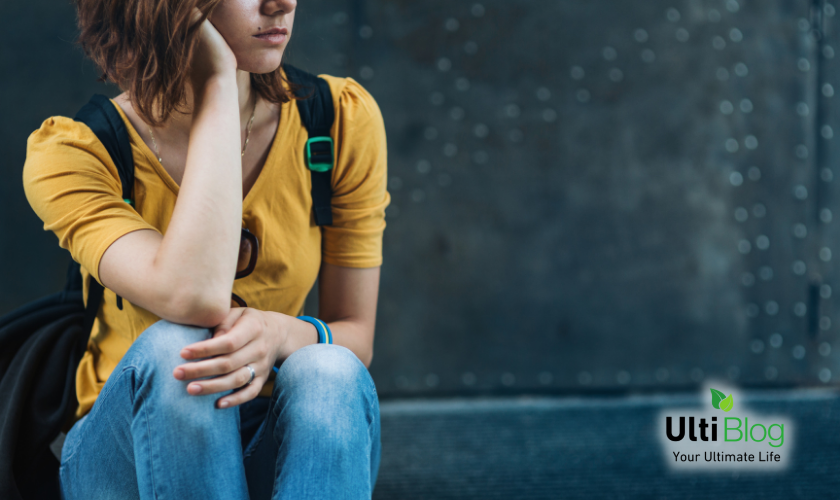 An image of a young girl sitting, under What Causes Separation Anxiety in Teenagers?