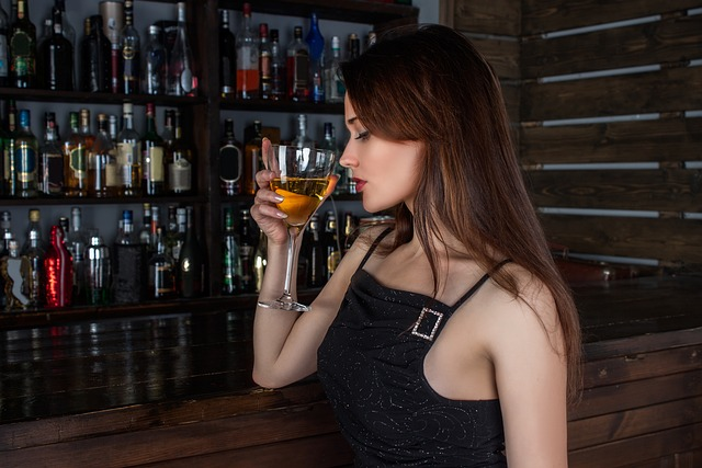 An image of an attractive woman holding a cocktail.