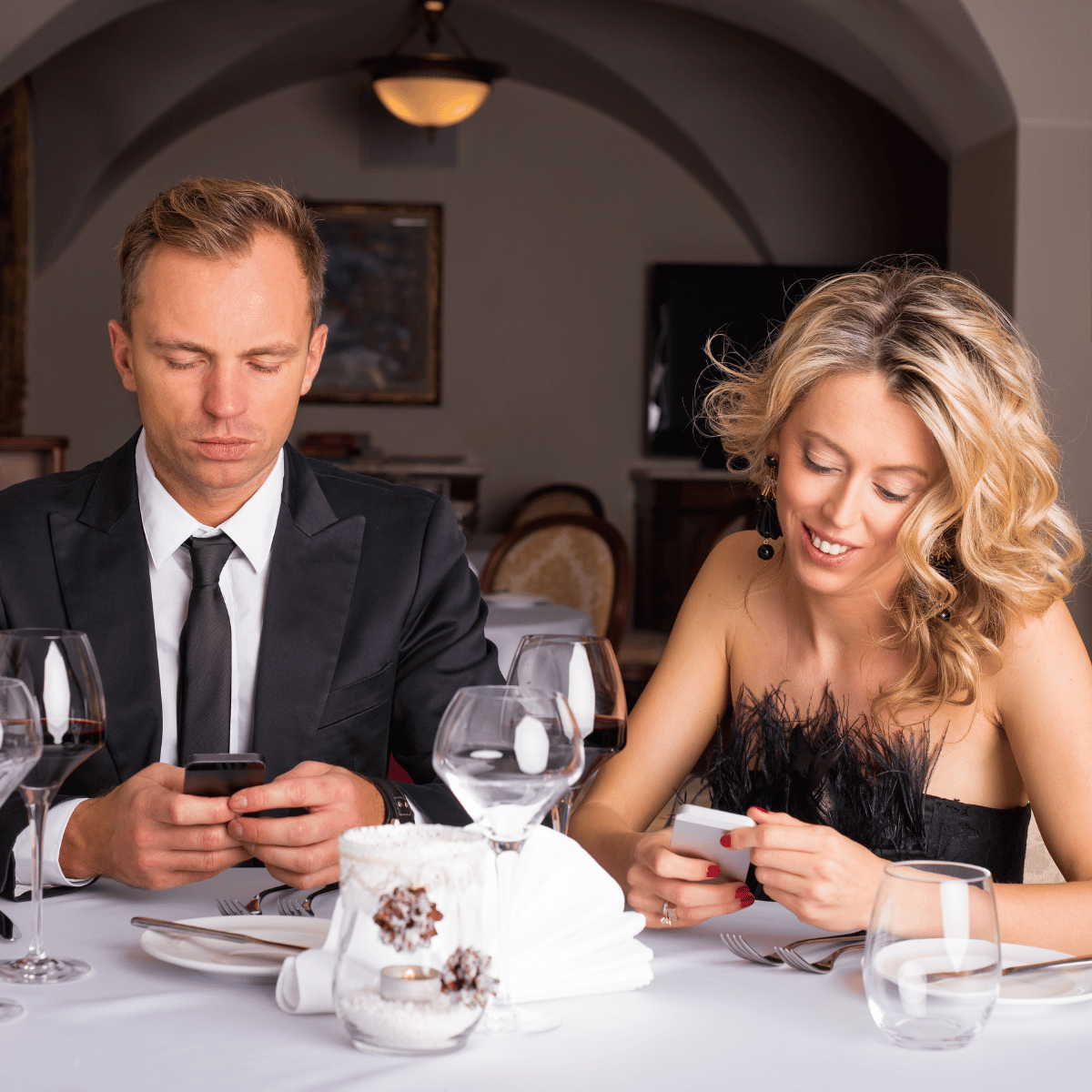 Man bored on phone during date with woman - Featured in: How Scorpio man acts when he lost interest