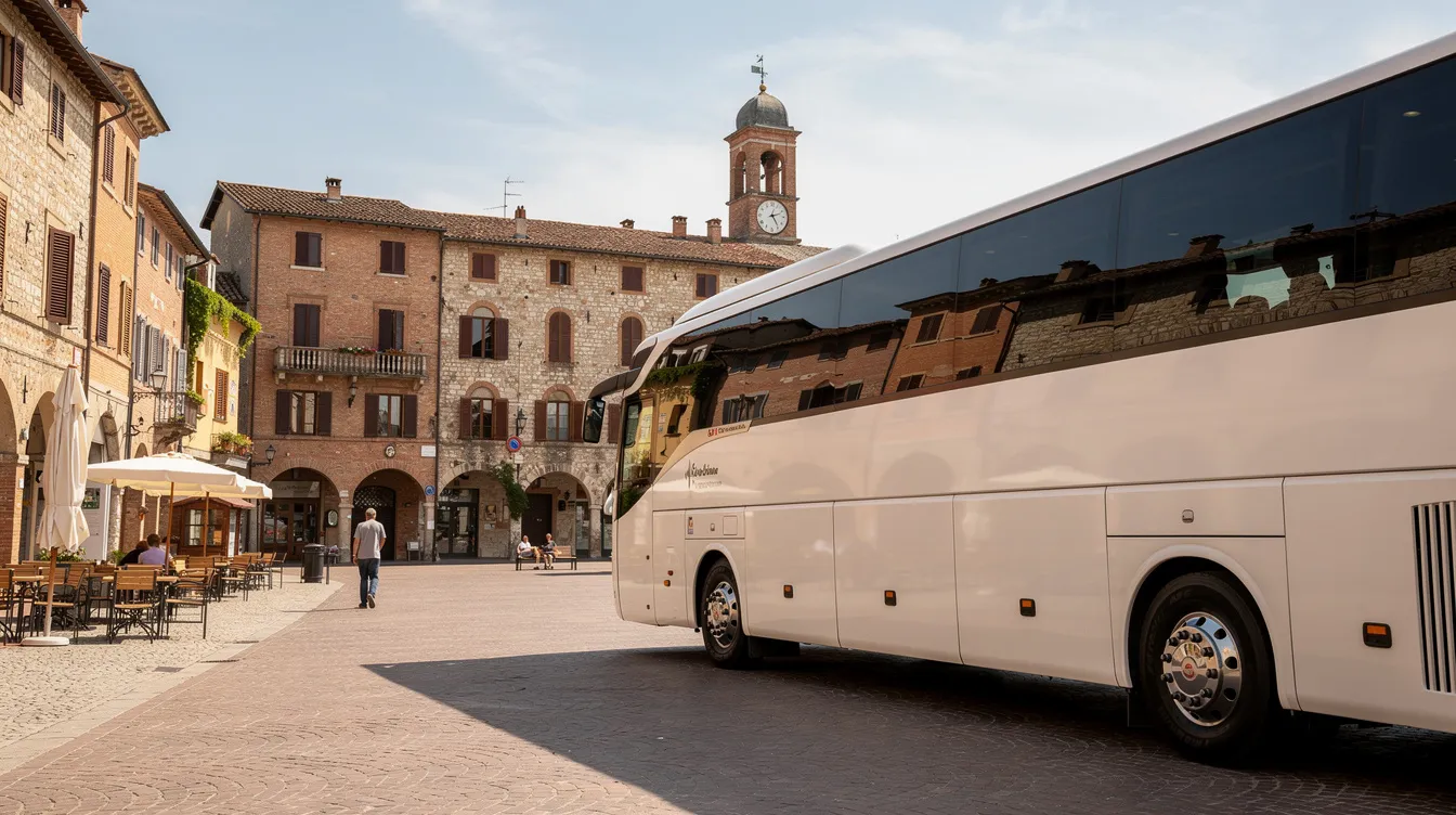 A large touring coach is parked near a historic town square, surrounded by charming buildings and visitors exploring the area. This scene is perfect for day trips and sightseeing adventures, inviting travelers to discover local attractions and enjoy a great day out.