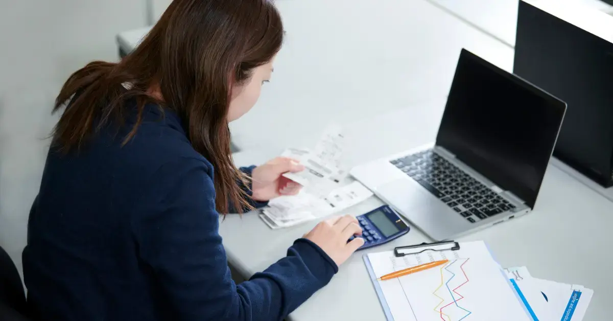 Woman organizing receipts and records to avoid a future CP504 notice.