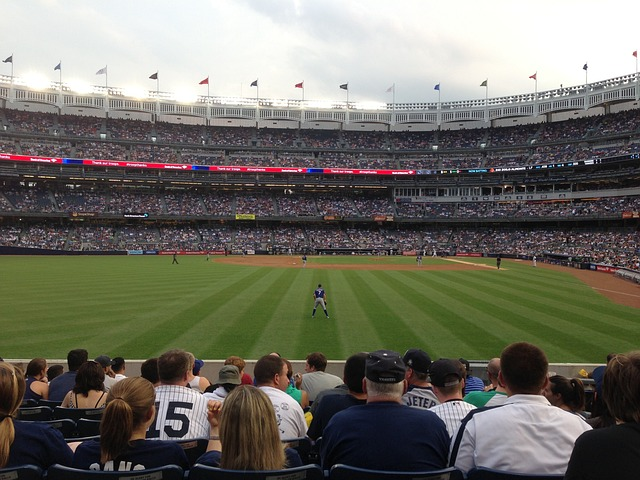 -A picture of Yankee Stadium with a crowd of baseball fans