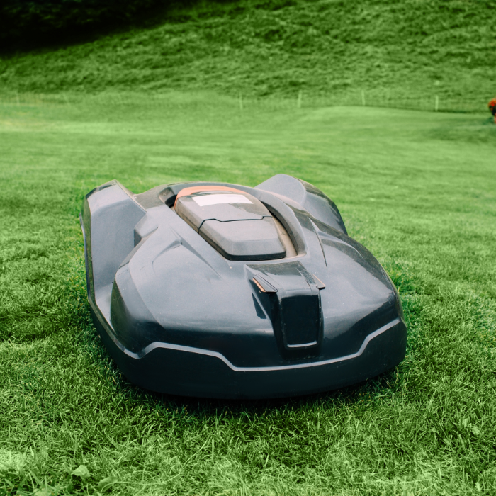 Robot lawn mower cutting grass in a garden