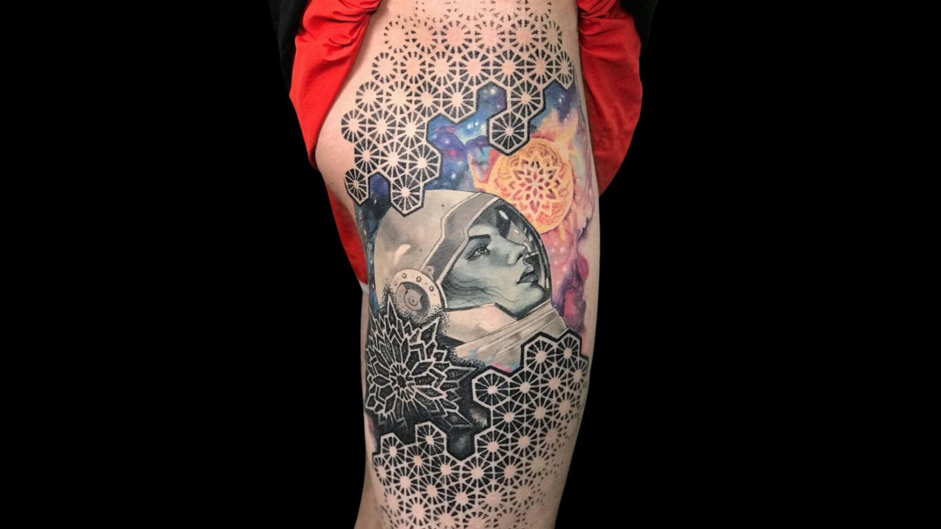 Multi-style geometric thigh tattoo by Corey Ferguson. Dedicated clients can team up with their artist to bring their ideas to  on the skin.