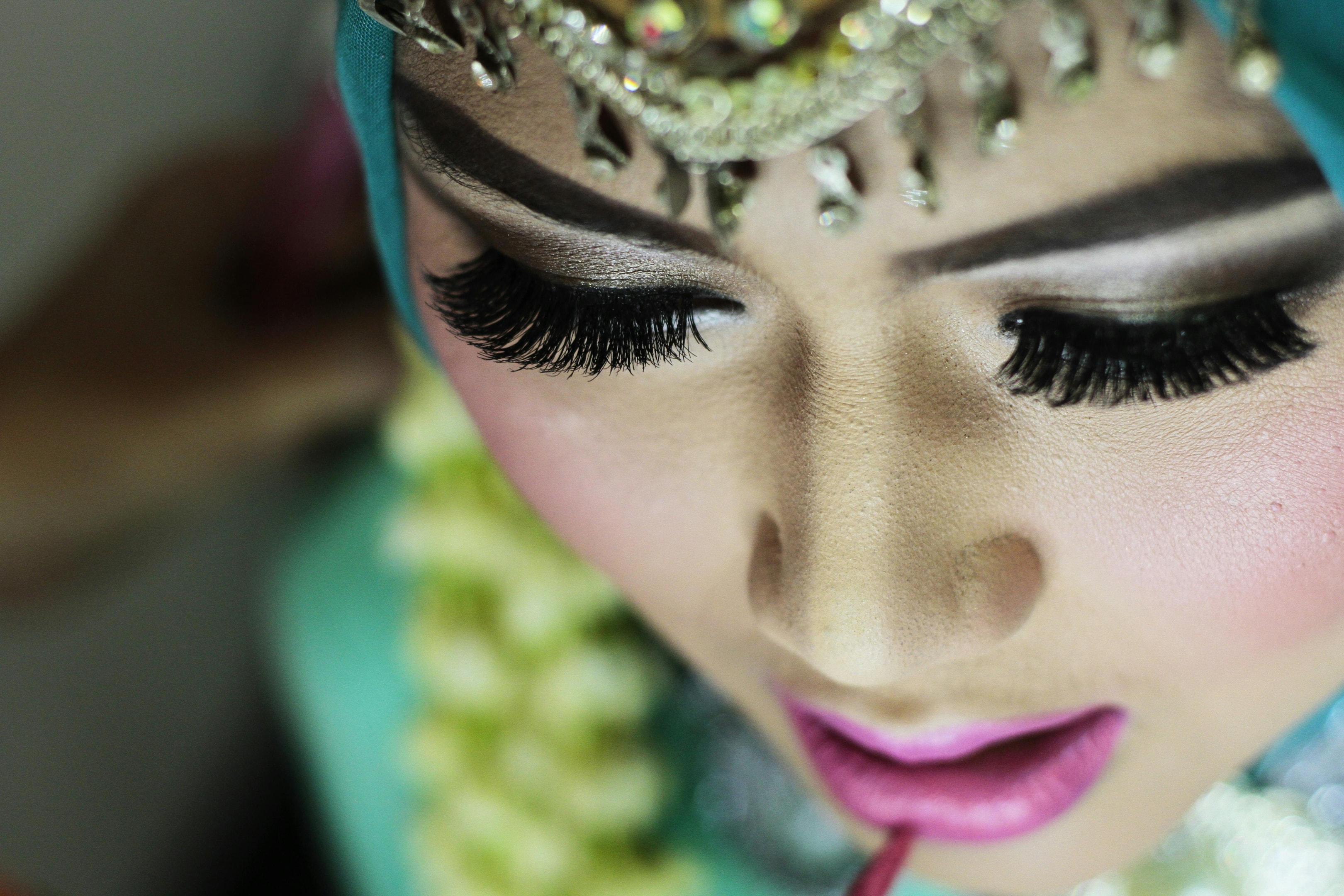 Closeup of long lashes of a Hijabi in traditional clothing