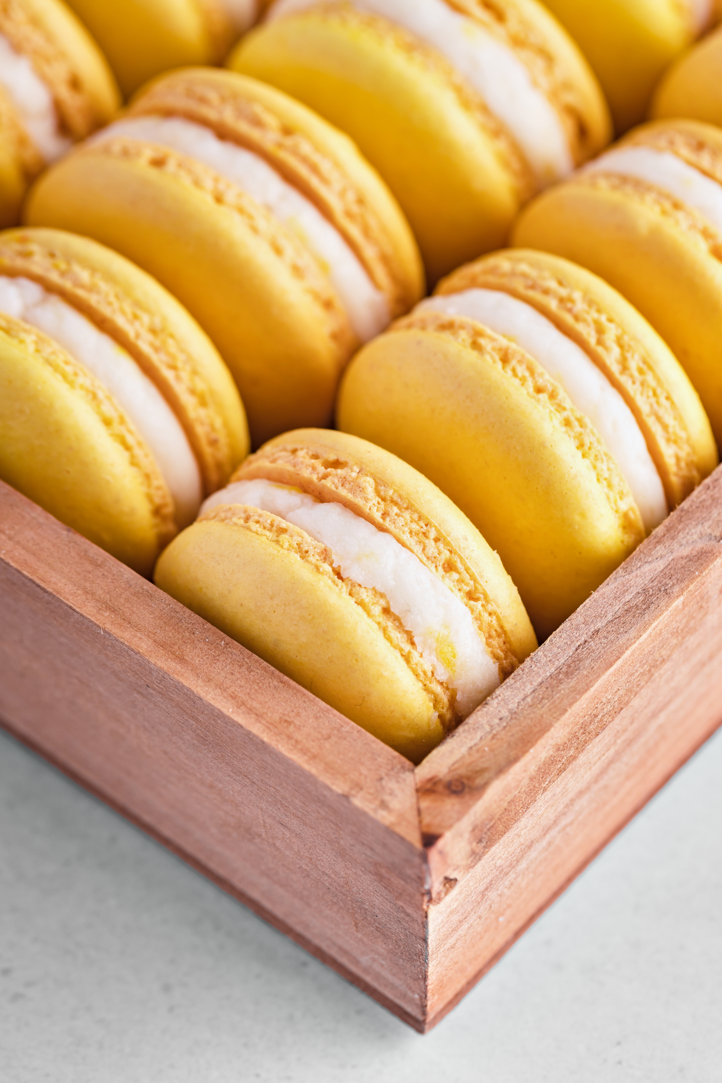 lemon macarons in a wooden box