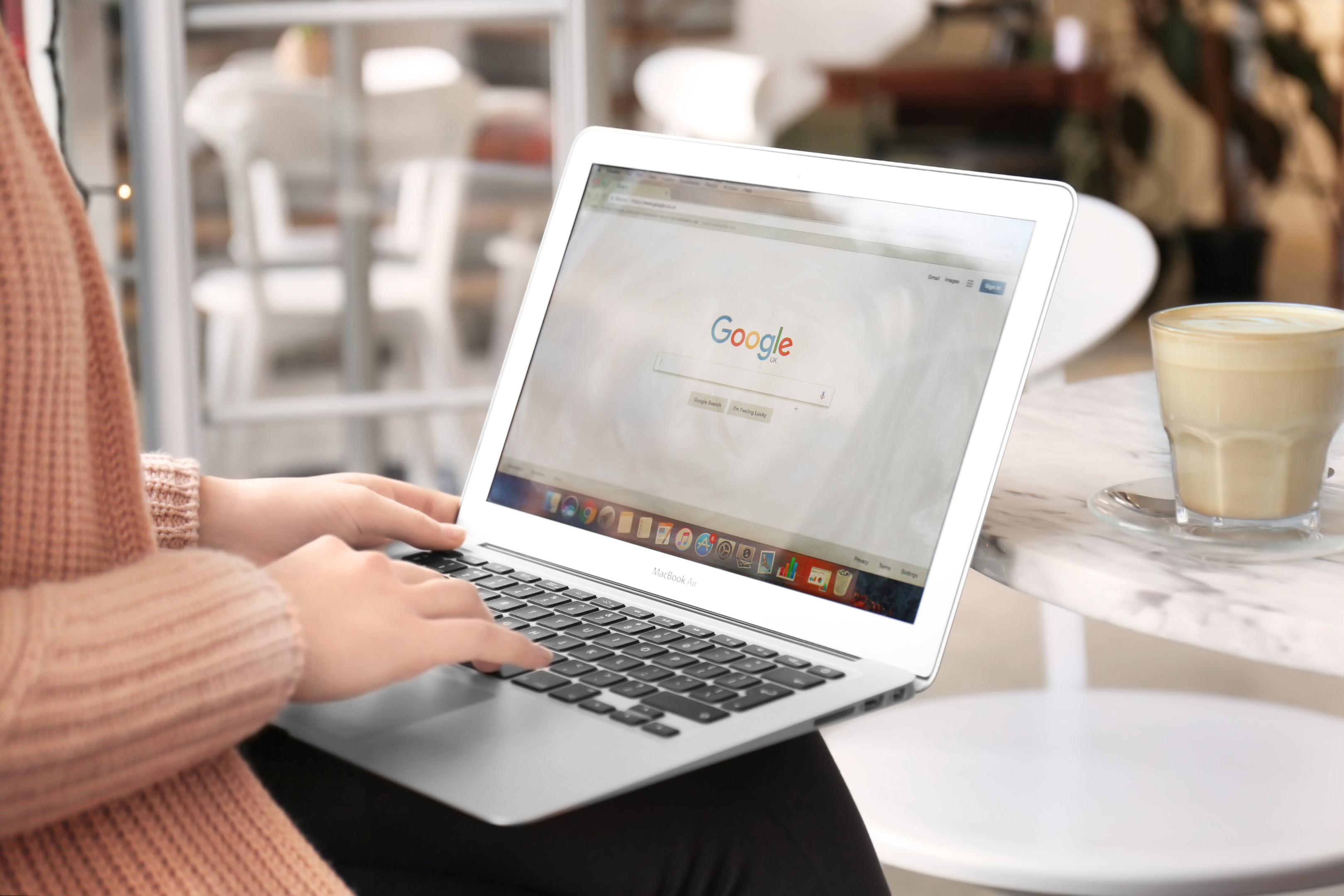 Woman using Google on laptop